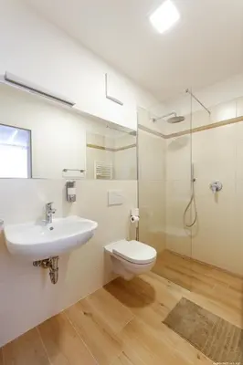 a bathroom with a sink and a toilet and a shower at Apartment Terme in Merano