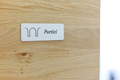 a sign that says m portal on a wooden table at Apartment Terme in Merano