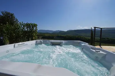 a jacuzzi tub with water in it at Weingut Windegg in Caldaro