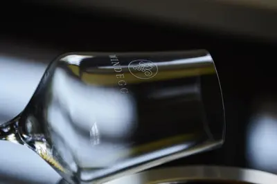 a cell phone is being poured into a coffee maker at Weingut Windegg in Caldaro