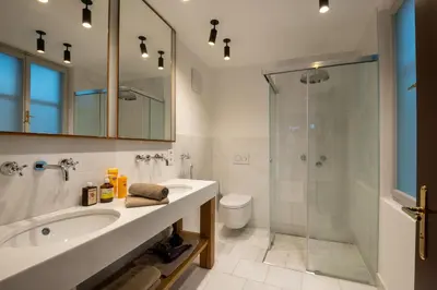 a bathroom with a sink and a shower at Augustiner in Meran in Merano