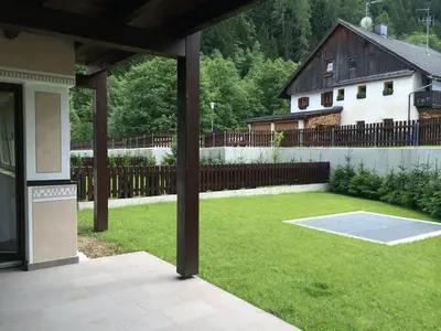 a large yard with a fence and a house at Chalet Martin in Valdaora