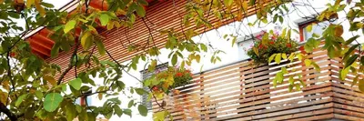 a building with flower pots on the side of it at Appartements Schusterbauer in Naz-Sciaves
