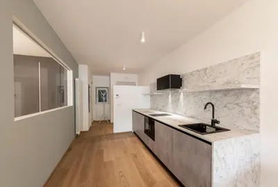 a kitchen with a sink and a counter top at Stay COOPER l Cooper apartments in Bolzano