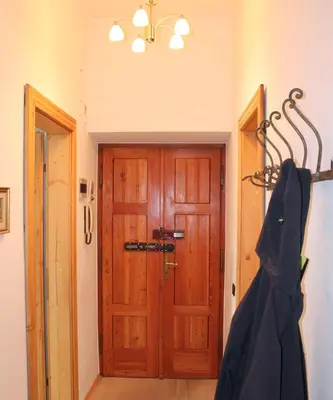 a wooden door in a room with at Plose Apartment in Bressanone