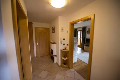 a hallway of a home with a room with a bathroom at Chalet Prinoth in Selva di Val Gardena