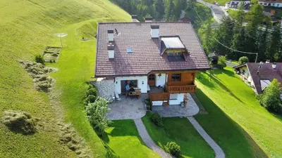 an overhead view of a house on a hill at Chalet Prinoth in Selva di Val Gardena