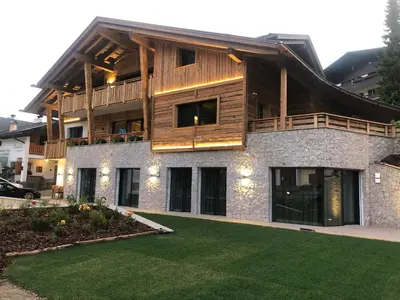 a large house with a balcony on top of it at Chalet Zenit in Selva di Val Gardena