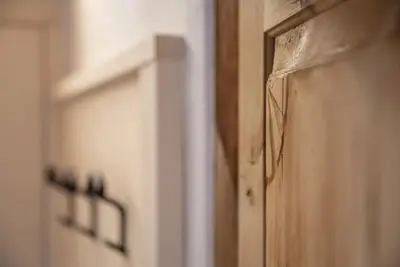 a close up of a wooden door in a room at ban Hofa in Bressanone
