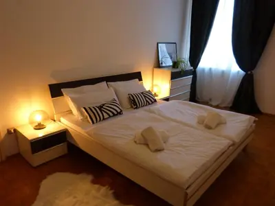a bedroom with a bed with two towels on it at Appartamento centro terme merano in Merano