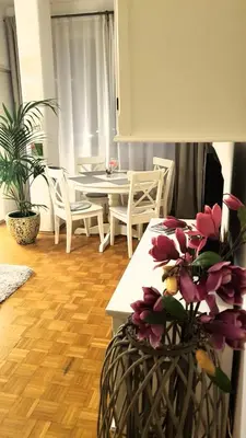 a kitchen and dining room with a table and chairs at Appartamento centro terme merano in Merano