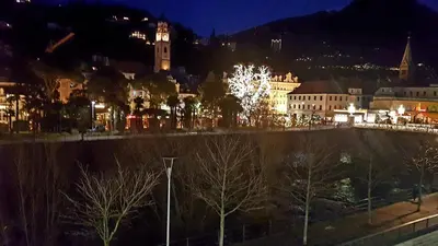 a view of a city at night with lights at Appartamento centro terme merano in Merano