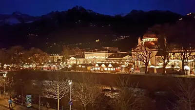 a view of a city at night with lights at Appartamento centro terme merano in Merano
