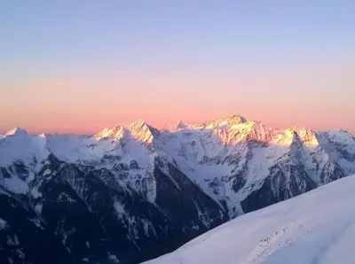 a view of snow covered mountains at sunset at Oberwirt in Selva dei Molini