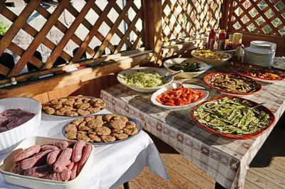 a table with many different types of food on it at Hotel Garni Vanadis in Ortisei