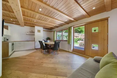 a kitchen and dining room with a table and chairs at Unterurban DIE ZWEI in Unsere Liebe Frau im Walde