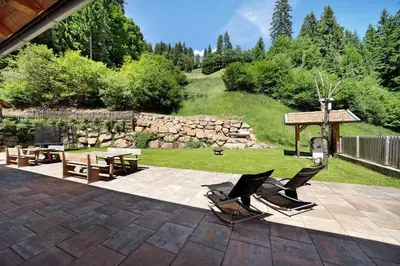a patio with two chairs and a picnic table at Unterurban DIE ZWEI in Unsere Liebe Frau im Walde