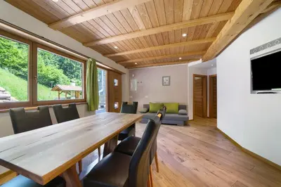 a dining room with a wooden table and chairs at Unterurban DIE ZWEI in Unsere Liebe Frau im Walde