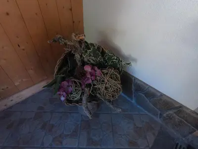 a bouquet of flowers sitting on a floor at ciasa de epi in Pera