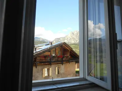 a window with a view of a mountain at CASA CAMPAGNA in Cavalese