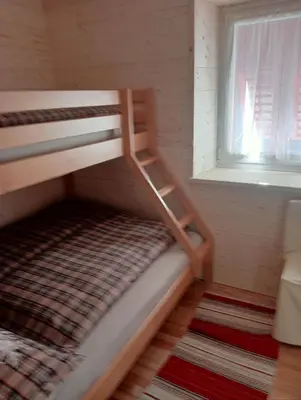 a bunk bed in a room with a window at CASA CAMPAGNA in Cavalese