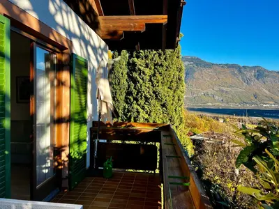 a balcony of a house with a view of the ocean at Oberjaistenhof in Lana