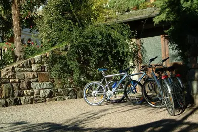 three bikes parked next to a stone wall at Oberjaistenhof in Lana