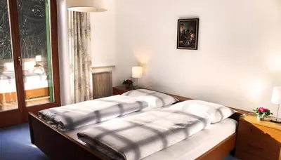 a room with three pillows sitting on a bench at Oberjaistenhof in Lana