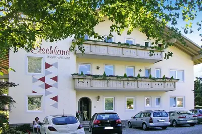 a building with cars parked in front of it at Apartment in Dorf Tirol near Tirol Castle in Tirolo