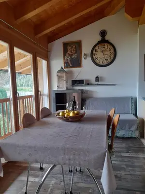 a dining room table with a bowl of fruit on it at Bertoldihof in Cortaccia