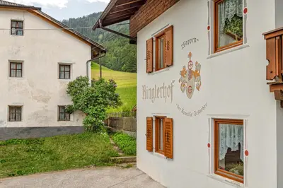 a house in the village with a view of the countryside at Ringlerhof in Braies