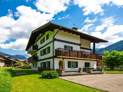 a large white building in the snow at Apartment Cincelli - Catinaccio by Interhome in Pozza di Fassa
