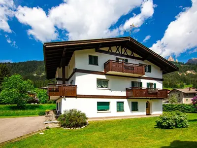a house with balconies on the side of it at Apartment Cincelli - Catinaccio by Interhome in Pozza di Fassa