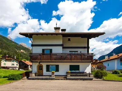 a house with a balcony on top of it at Apartment Cincelli - Catinaccio by Interhome in Pozza di Fassa