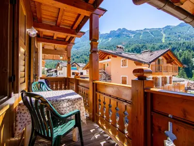 a snow covered village with mountains in the background at Apartment Carmen-3 by Interhome in Soraga