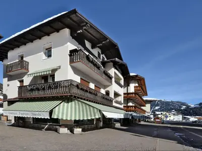 a building with balconies on the side of a street at Apartment Ghetta by Interhome in Vigo di Fassa