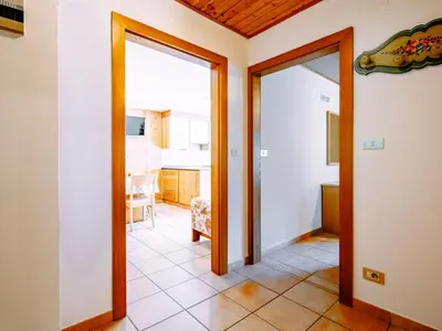 a hallway with a door leading to a kitchen at Apartment Cincelli - Marmolada by Interhome in Pozza di Fassa