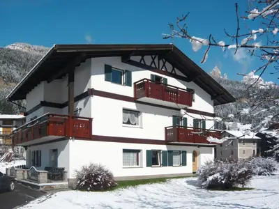 a bedroom with a bed and a window at Apartment Cincelli - Marmolada by Interhome in Pozza di Fassa
