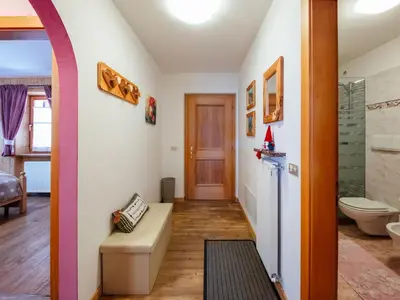 a bathroom with a shower and a toilet in a room at Apartment Brunel-1 by Interhome in Pozza di Fassa