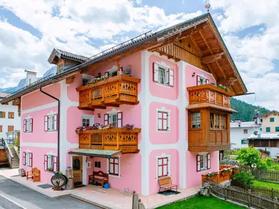 a mountain covered in snow with a blue sky at Apartment Brunel-1 by Interhome in Pozza di Fassa