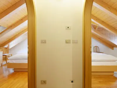 a mirror in a room with two beds at Apartment Ardoney-2 by Interhome in Campitello