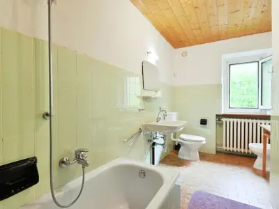 a bathroom with a toilet and a sink and a shower at Apartment Puntea by Interhome in Ortisei
