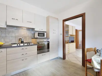 a balcony with a view of snow covered mountains at Apartment Bernard-2 by Interhome in Campestrin