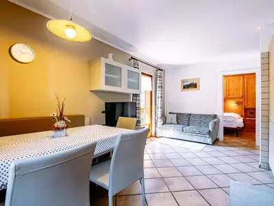 a snow covered village with mountains in the background at Apartment Carmen-4 by Interhome in Soraga
