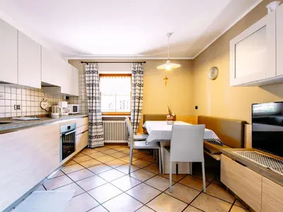 a bedroom with two beds and a flat screen tv at Apartment Carmen-4 by Interhome in Soraga
