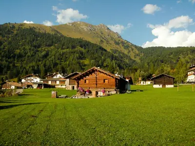 a log cabin with snow on the roof at Apartment Chalet Baita Tabià Dolomites by Interhome in Bellamonte