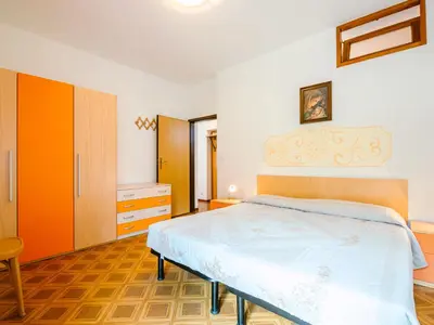 a bedroom with a bed in a room at Apartment Pederiva - SOF740 by Interhome in Soraga