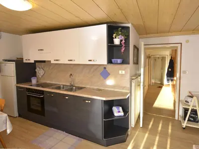 a kitchen with a sink and a counter top at Apartment Deluca by Interhome in Pozza di Fassa