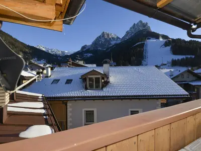 a view from the balcony of a house with a roof at Apartment Deluca by Interhome in Pozza di Fassa