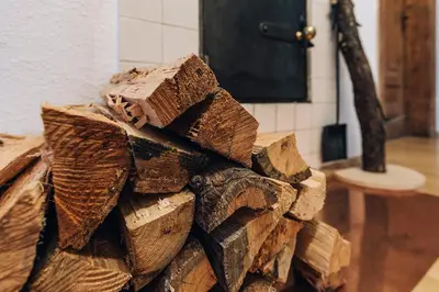 a pile of wood sitting on the floor in a room at Untersteinhaus in Aldino